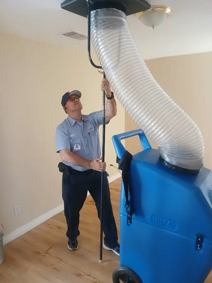 Furnace Tune-Up technician using HEPA equipment in Kanab